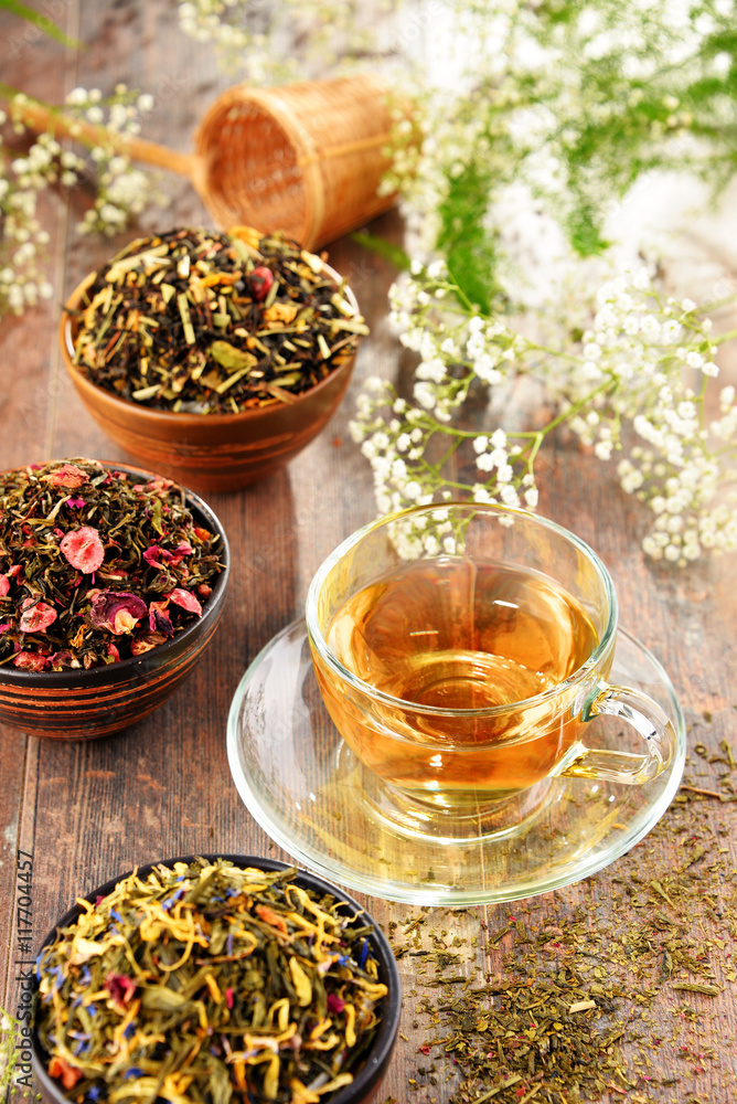 Composition with cup of tea and bowls of tea leaves Composition with cup of tea and bowls of tea leaves