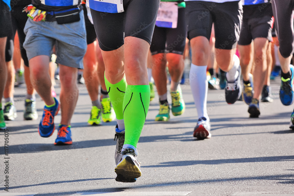 Marathon running race, runners feet on road, sport, fitness and healthy lifestyle concept
Marathon running race, runners feet on road, sport, fitness and healthy lifestyle concept