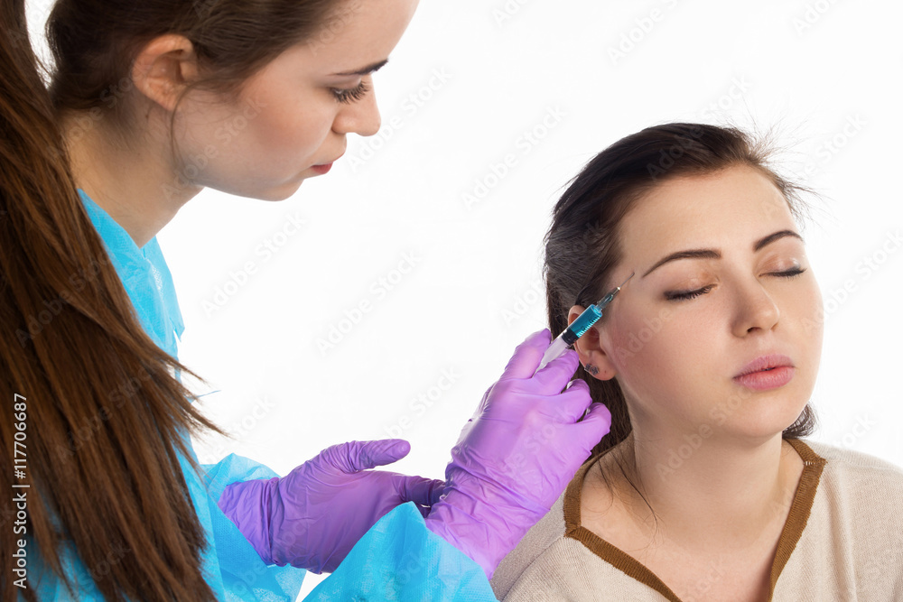 Doctor injects a botox Doctor injects a botox