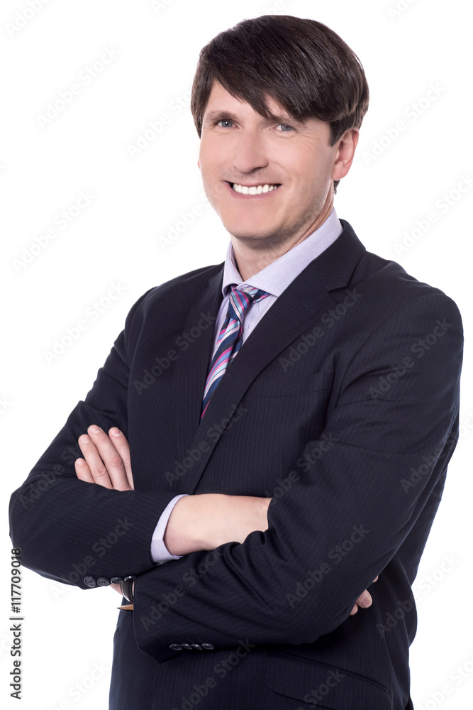 Smiling corporate guy posing with arms crossed. Smiling corporate guy posing with arms crossed.