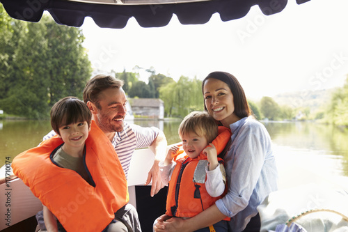 Family Enjoying Day Out In Boat On River Together © Monkey Business