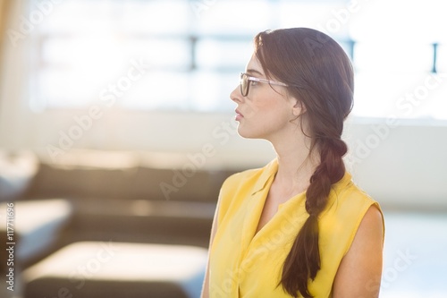 Free Download Thoughtful female business executive standing - GFXLoad