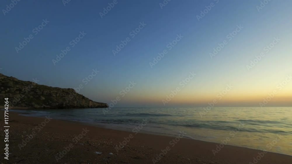 Beautiful timelapse of sunset over the sea water with waves. Beautiful timelapse of sunset over the sea water with waves.