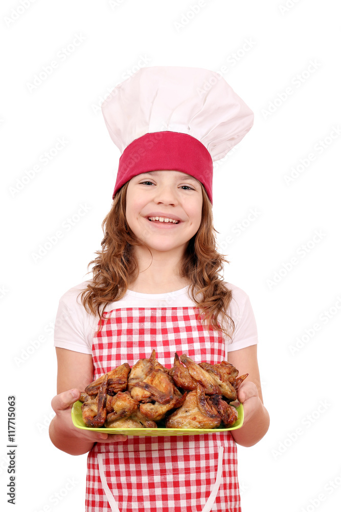 happy little girl cook with chicken wings on plate happy little girl cook with chicken wings on plate