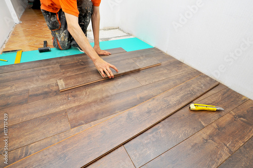 Wallpaper Mural Carpenter doing laminate floor work Torontodigital.ca