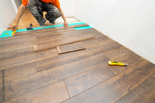 Wallpaper Mural Carpenter doing laminate floor work Torontodigital.ca
