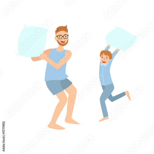 Dad And Son Pillow Fighting In Pajamas