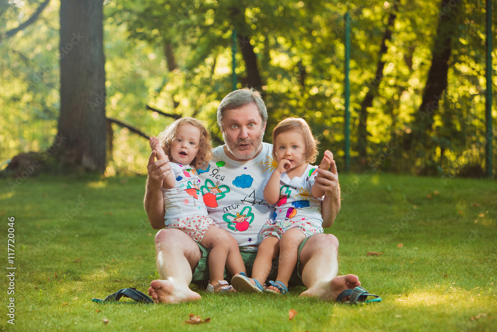 Fototapeta premium Portrait Of Grandfather With Granddaughters