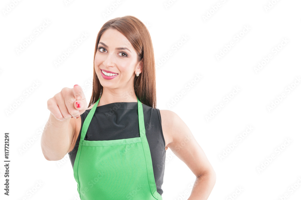 Smiling attractive employee pointing finger at you Smiling attractive employee pointing finger at you