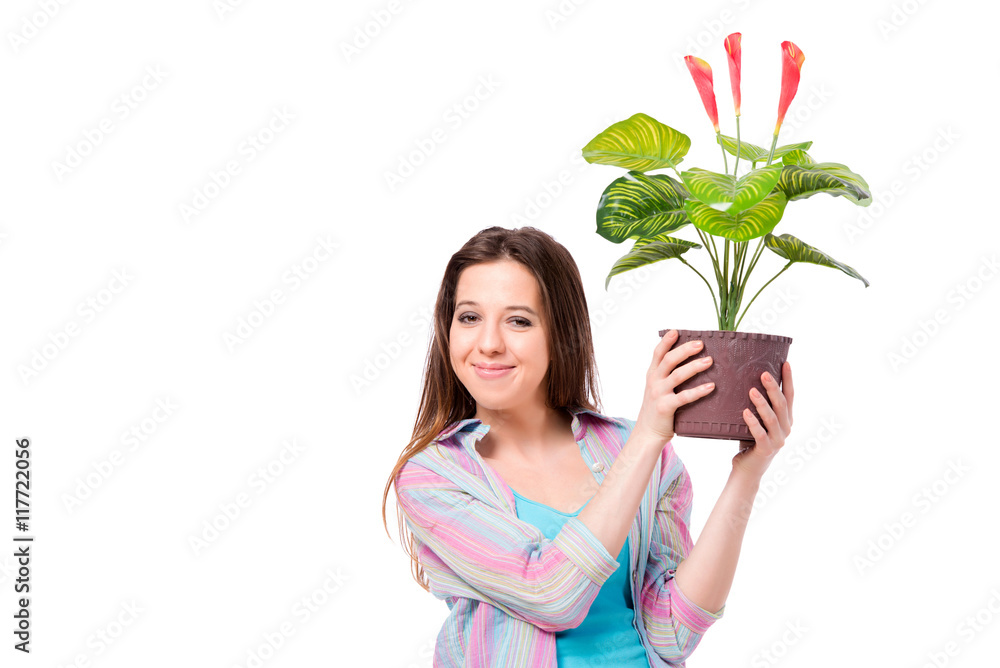Young woman taking care of plants isolated on white Young woman taking care of plants isolated on white