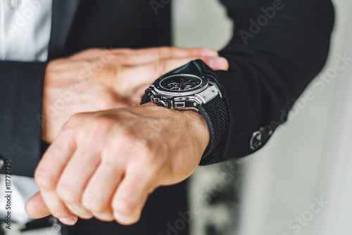 businessman looking at his watch.