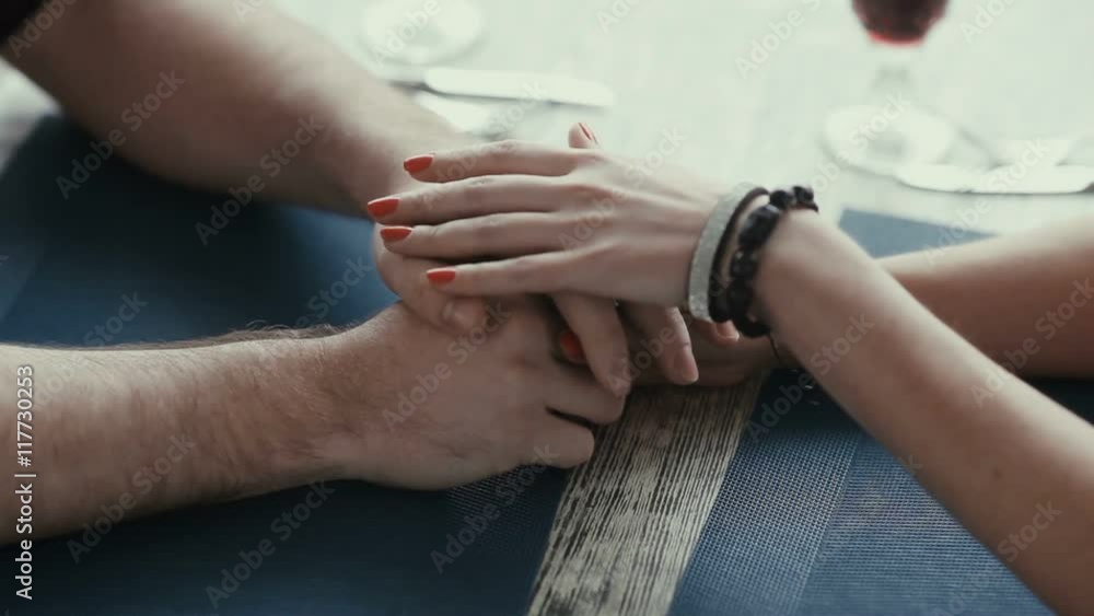 Young people took romantic hands. Young people took romantic hands.
