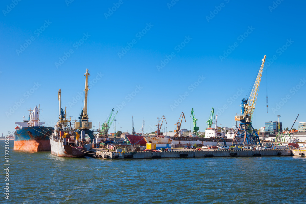 Tanker ship and working crane in Klaipeda port, Lithuania.