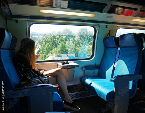 Woman traveling alone by train