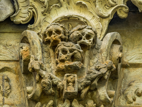 Photos skull and bones ornaments on an old cemetery