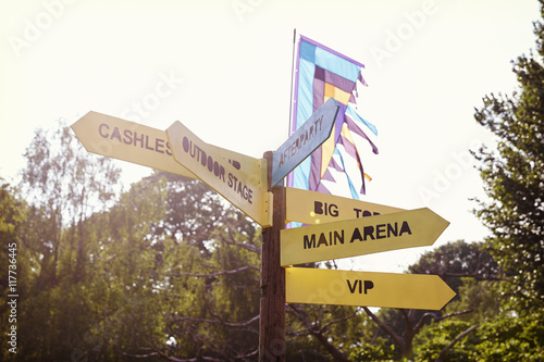 Close Up Of Signpost At Outdoor Music Festival photo