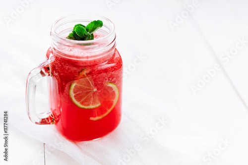 Healthy watermelon smoothie on a wood background. Freshly blended watermelon Smoothies. © glazunoff