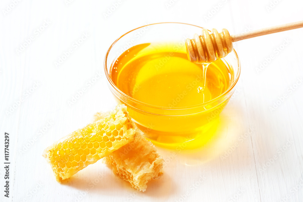 Honey with and wooden spoon