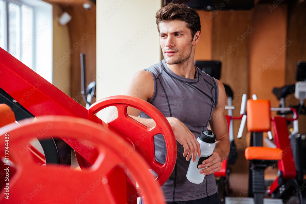Portrait of a bodybuilder resting after workout at fitness gym Portrait of a bodybuilder resting after workout at fitness gym