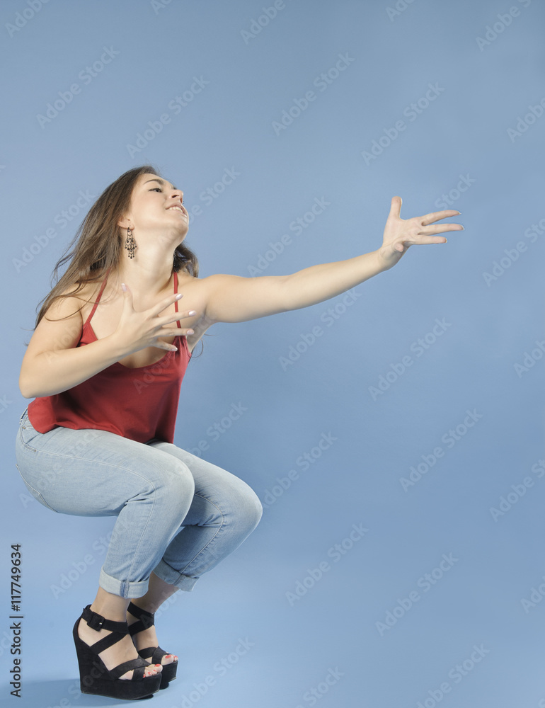 Passionate girl pulls arms forward. . Passionate girl pulls arms forward. .