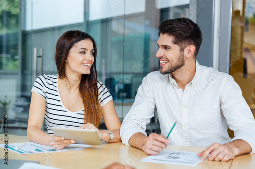 Businessman and businesswoman working together in office