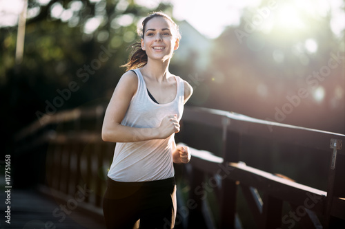 Athletic woman jogging in nature