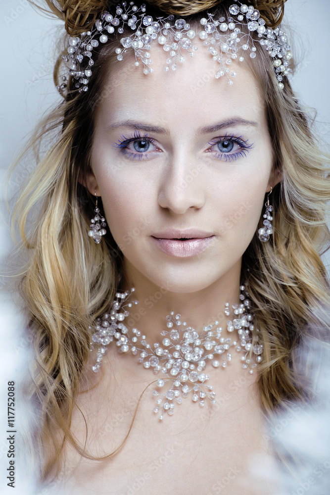 beauty young snow queen with hair crown on her head, complicate hairstyle, winter concept beauty young snow queen with hair crown on her head, complicate hairstyle, winter concept