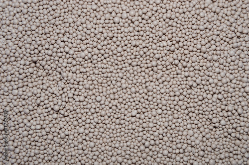 Background of mineral fertilizers. Balls of NPK fertilizers.