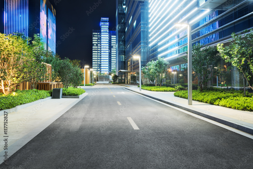 city empty traffic road with cityscape in background city empty traffic road with cityscape in background