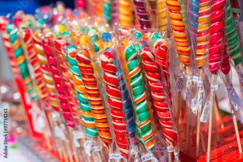 Colorful handmade swirl lollipops on street market