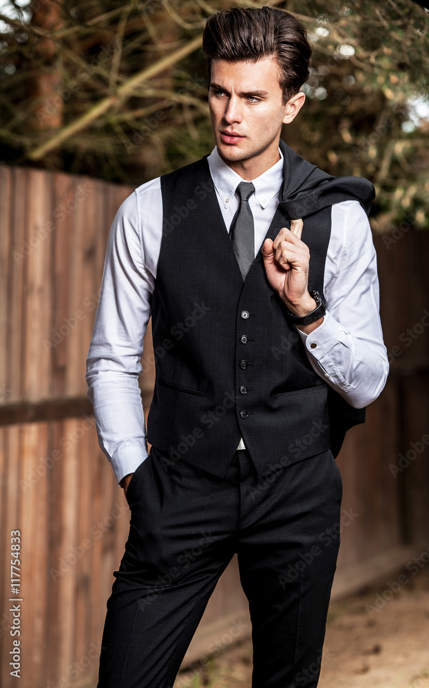 Young Stylish Man Posing Formal Suit Grey Stock Photo by ©IgorVetushko  185161820