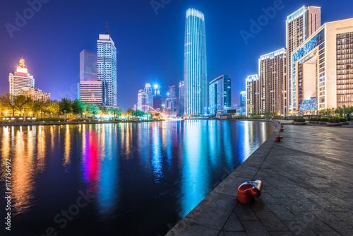 Tianjin cityscape and haihe river at night photo