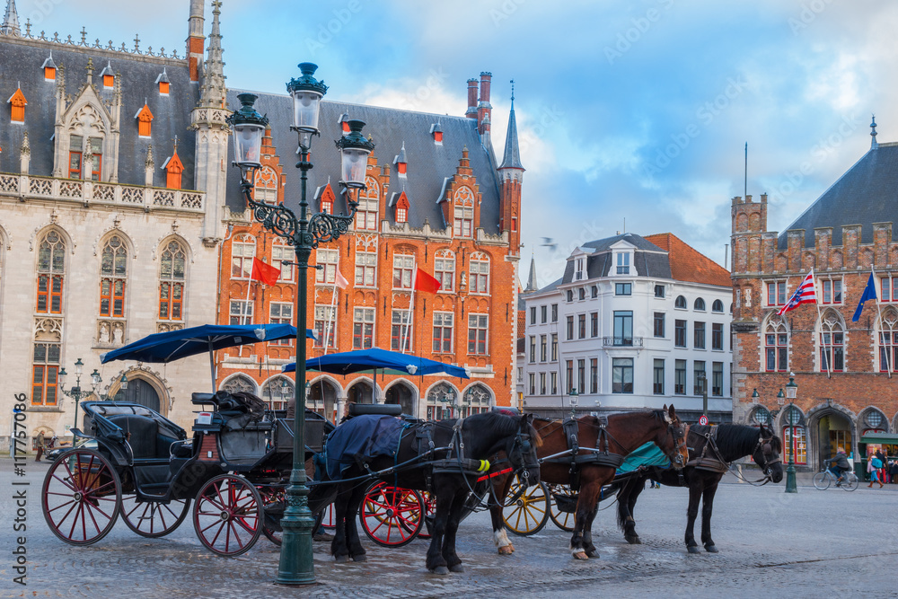 Brugge city - public horse and carriage in main square for tourists in Belgium