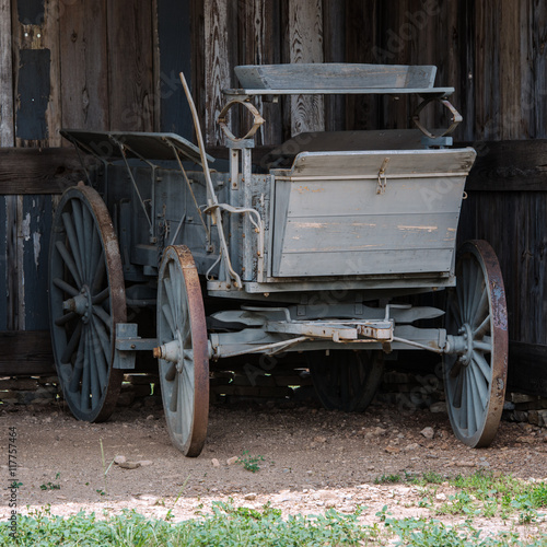 Old horse drawn carriage in a barn