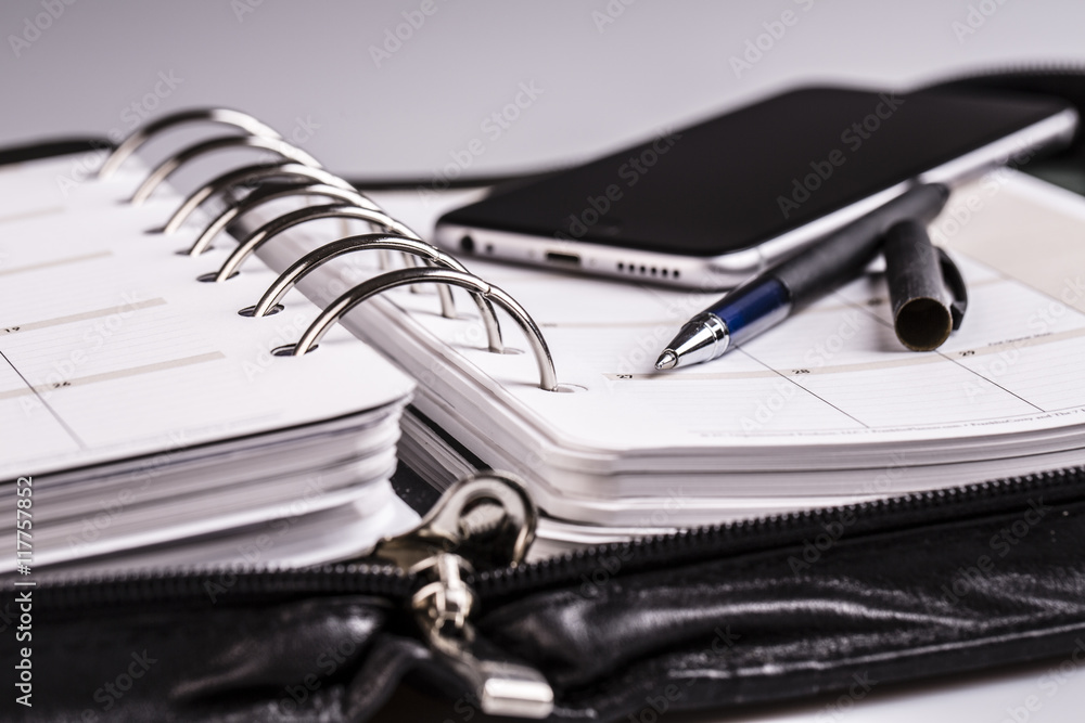 planning concept - calendar, cellphone, pen planning concept - calendar, cellphone, pen