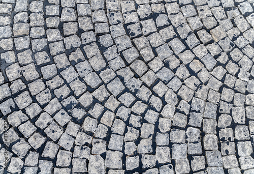 Grey cobblestone pavement background