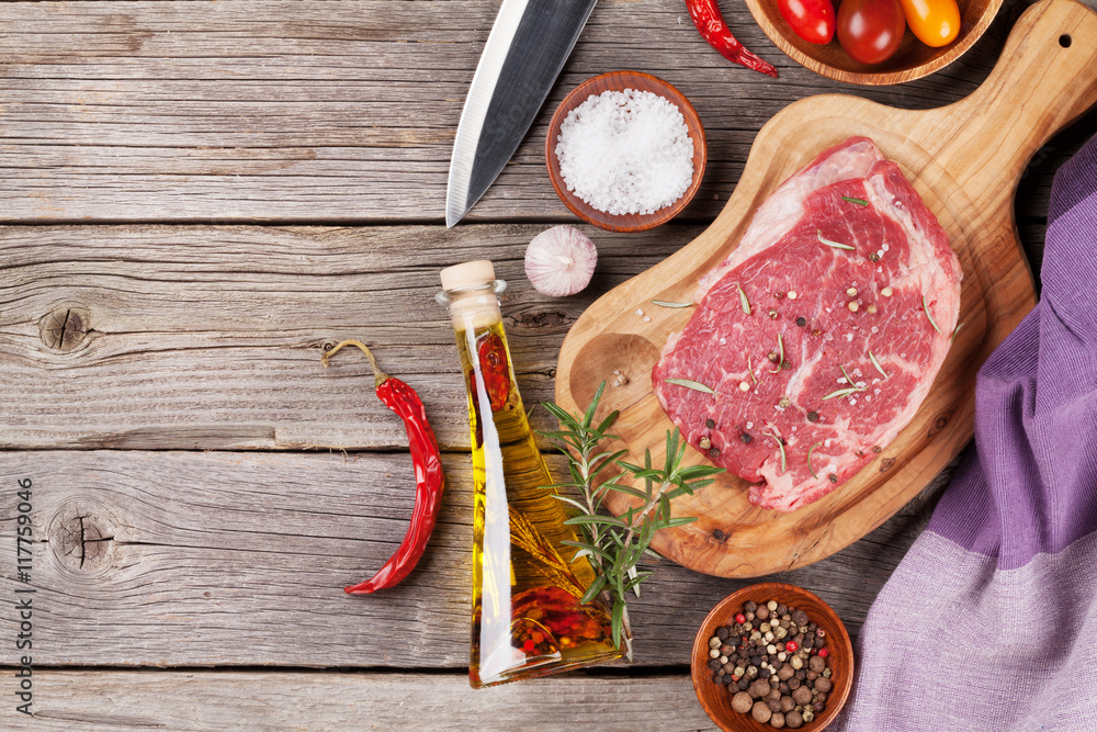 Raw beef steak with spices and herbs Raw beef steak with spices and herbs
