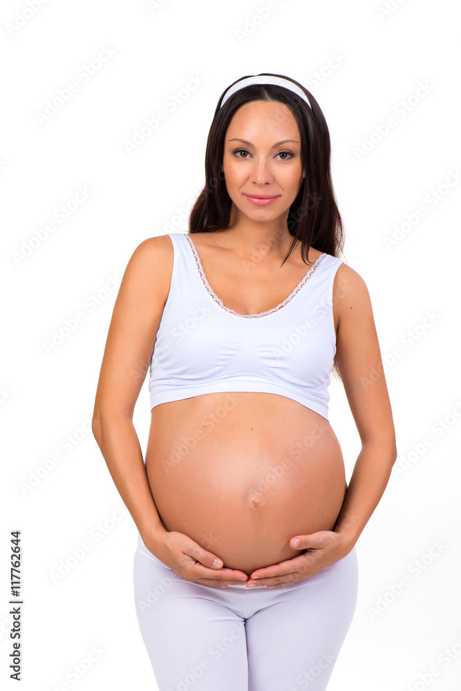 Beautiful young pregnant woman hugging tummy. Healthy and happy pregnancy Beautiful young pregnant woman hugging tummy. Healthy and happy pregnancy