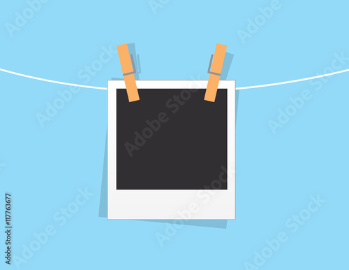 Single blank photo hanging from string
