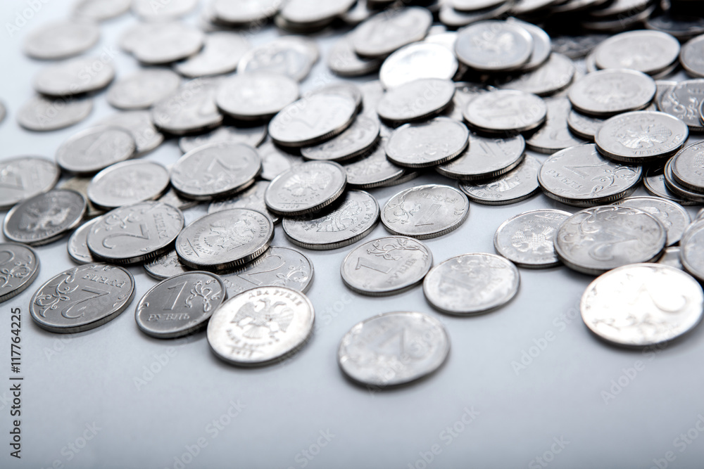 pile of coins on a white