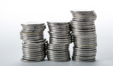 stacks of coins on a white background