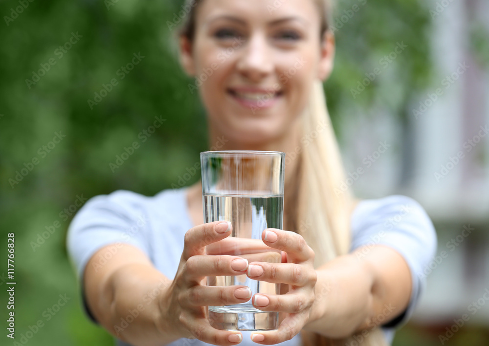 Beautiful girl drinking water on street Beautiful girl drinking water on street