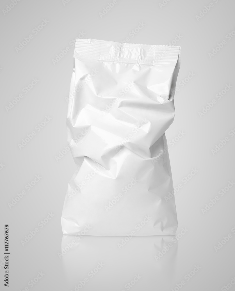 Crumpled blank paper bag package with creases on gray Crumpled blank paper bag package with creases on gray