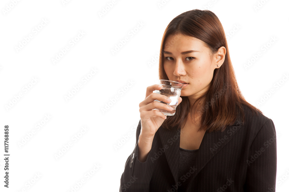 Young Asian woman with a glass of drinking water. Young Asian woman with a glass of drinking water.