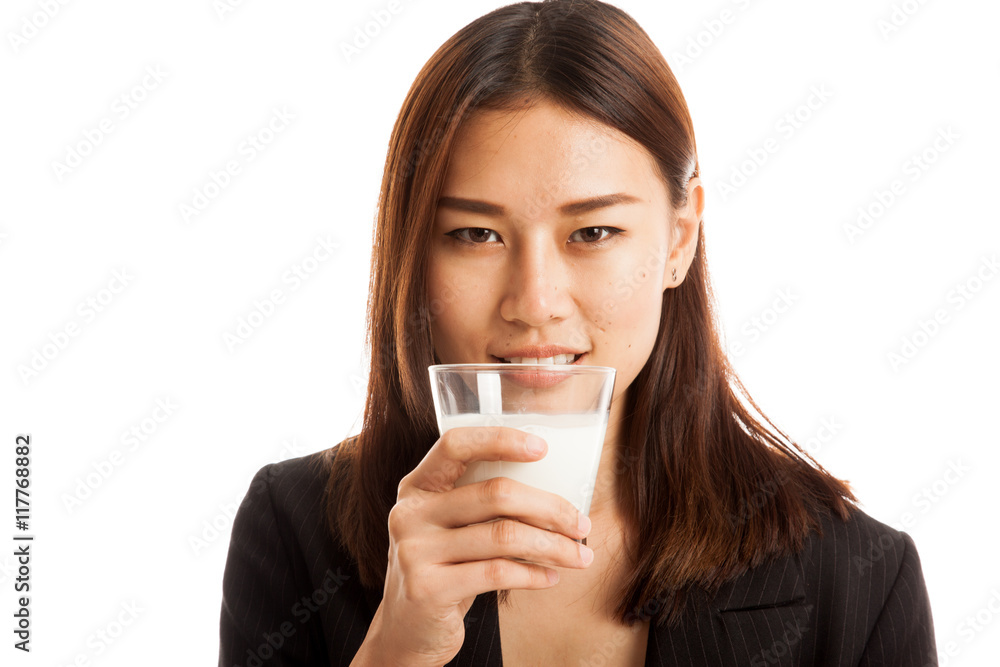 Healthy Asian woman drinking a glass of milk. Healthy Asian woman drinking a glass of milk.