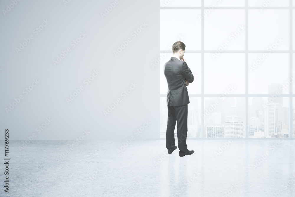 Thoughtful man in empty room