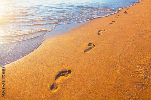 beach, wave and footprints