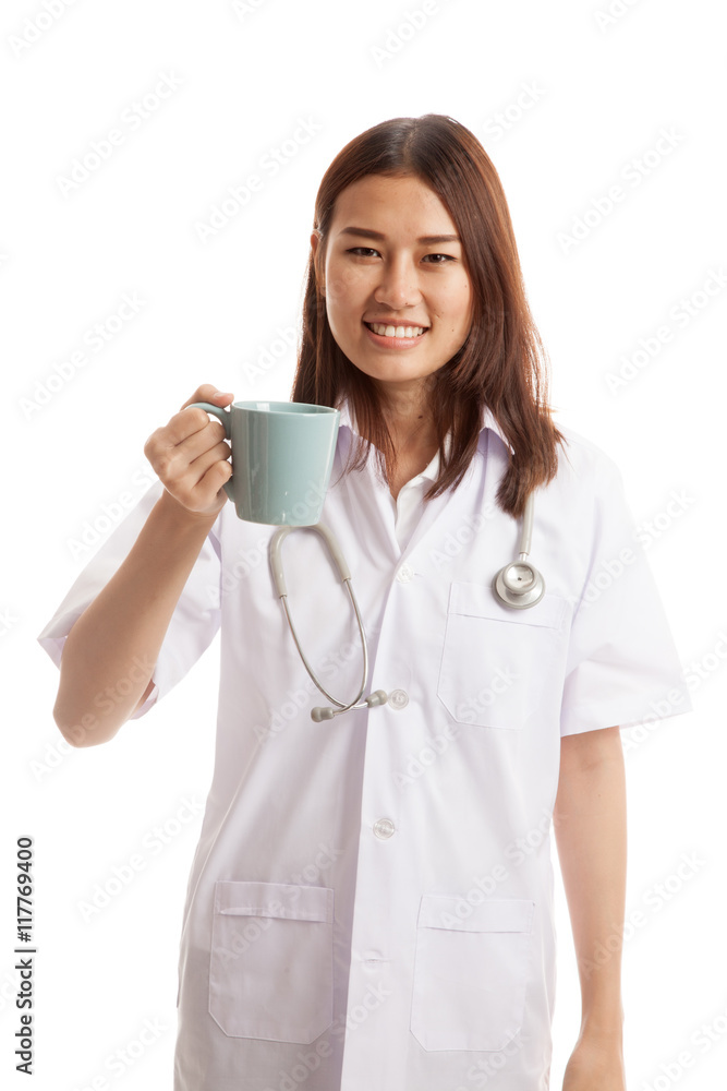 Young Asian female doctor hold a mug and smile.