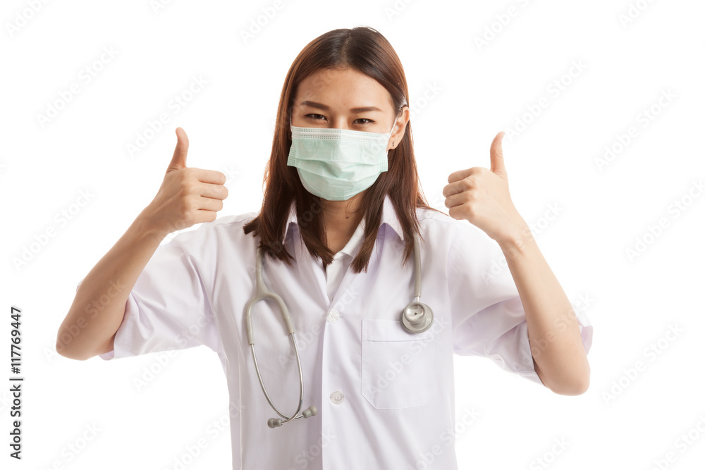 Young Asian female doctor thumbs up with both hands. Young Asian female doctor thumbs up with both hands.