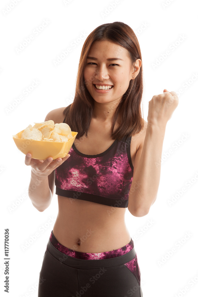 Beautiful Asian healthy girl eat potato chips. Beautiful Asian healthy girl eat potato chips.